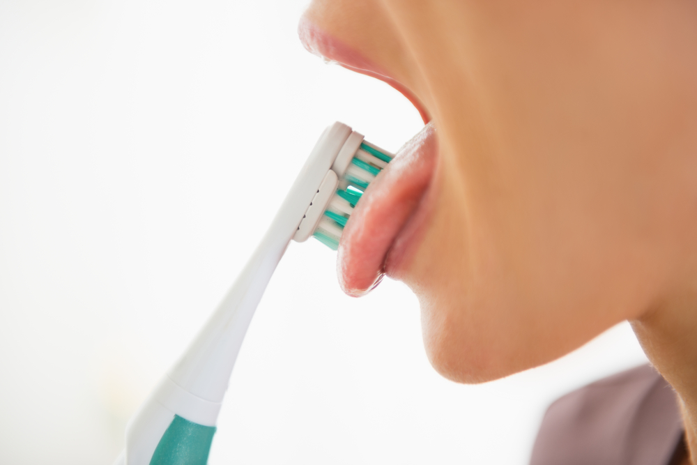 Clean your tongue with your toothbrush